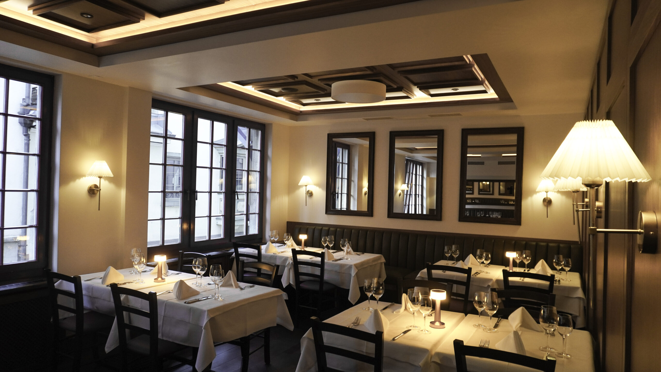 Elegant dining room setup at Zum Königstuhl Swiss restaurant in Zurich
