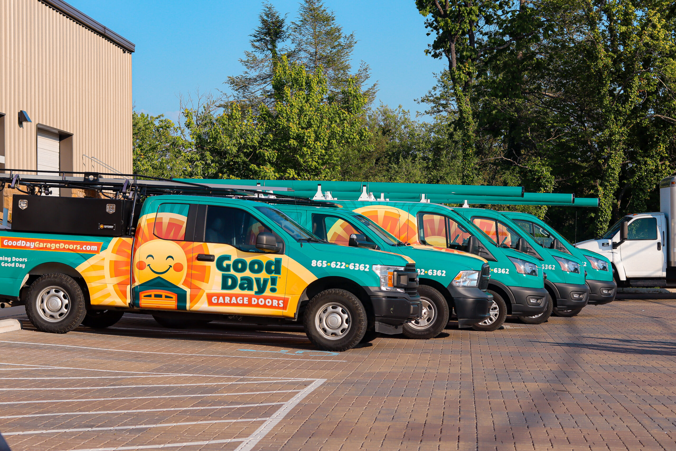 Good Day Garage Doors fleet of branded vehicles.