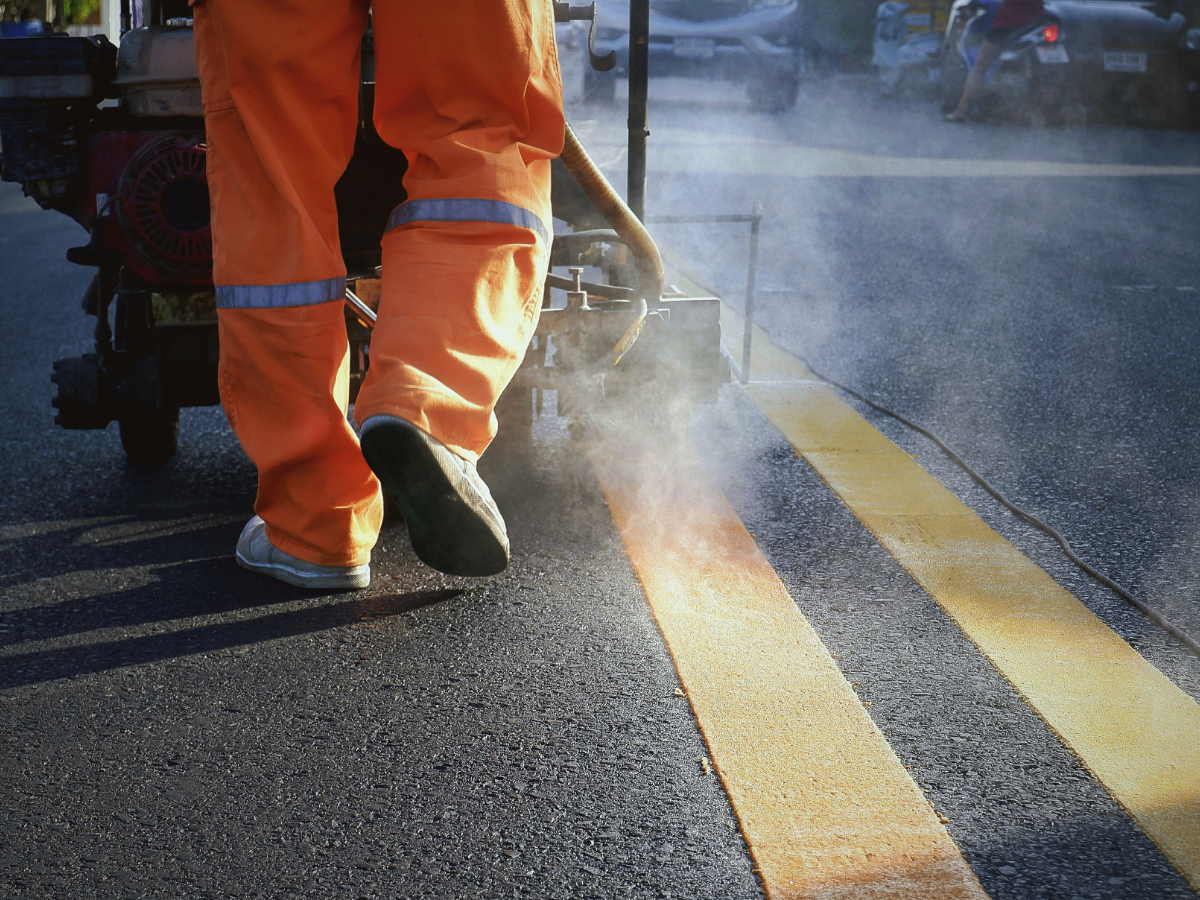 Freshly striped parking lot showcasing clear lines and organized spaces, emphasizing safety and compliance
