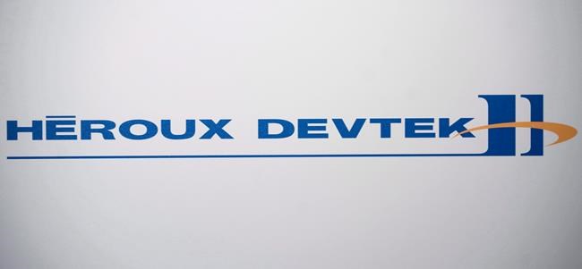 A Héroux-Devtek logo is shown at the company's annual general meeting in Montreal, Thursday, August 2, 2012. Héroux-Devtek Inc. says its shareholders have voted to approve a deal that will see the company acquired by a private equity firm. THE CANADIAN PRESS/Graham Hughes