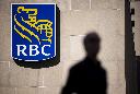 People walk past the Royal Bank Tower in Montreal on Thursday, June 19, 2025. THE CANADIAN PRESS/Christopher Katsarov