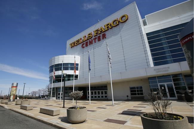 FILE- The Wells Fargo Center, home of the Philadelphia Flyers NHL hockey team and the Philadelphia 76ers NBA basketball team, is seen, Saturday, March 14, 2020, in Philadelphia. The banking giant Wells Fargo has decided it will not renew its naming rights deal with the arena in the South Philadelphia sports complex. (AP Photo/Matt Slocum, File)