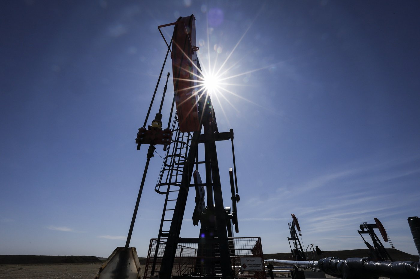 A pumpjack draws out oil and gas from a well head near Calgary, Alta., Tuesday, May 6, 2025. THE CANADIAN PRESS/Jeff McIntosh
