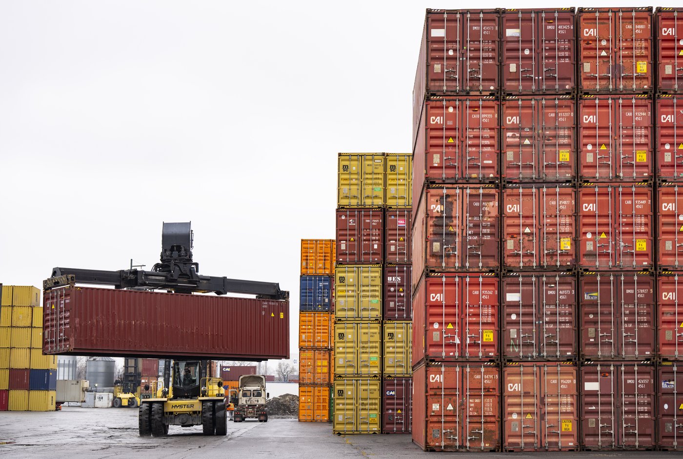 File photo — Shipping containers are stacked at a logistics yard in Montreal on Wednesday, April 15, 2026. THE CANADIAN PRESS/Christinne Muschi