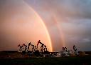 A rainbow appears to come down on pumpjacks drawing out oil and gas from wells near Calgary, Alta., Monday, Sept. 18, 2023. THE CANADIAN PRESS/Jeff McIntosh