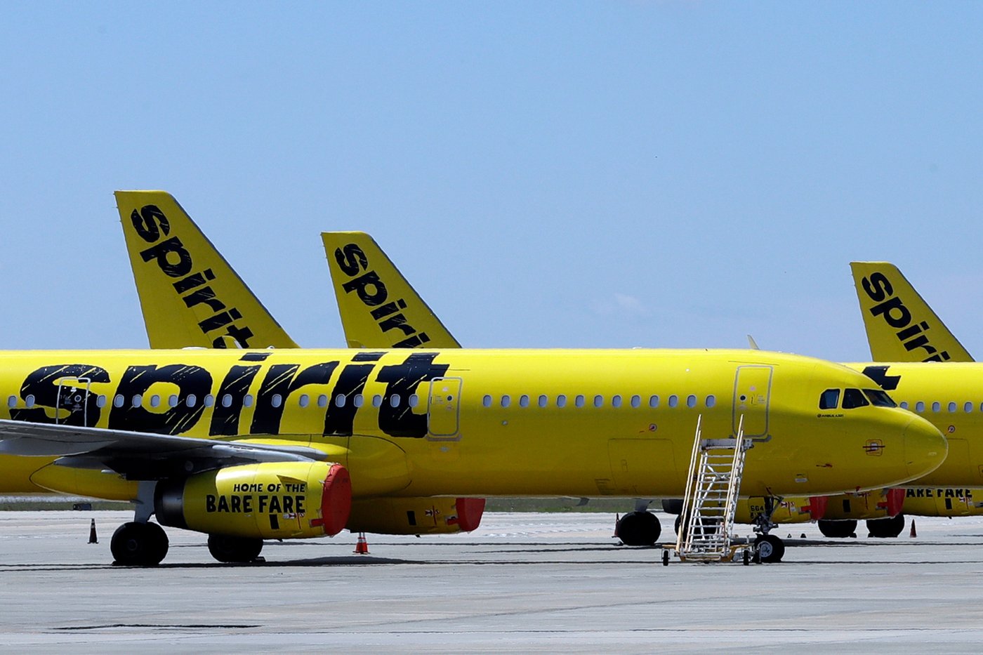 A line of Spirit Airlines jets sit on the tarmac at the Orlando International Airport on May 20, 2020, in Orlando, Fla. (AP Photo/Chris O'Meara, File)