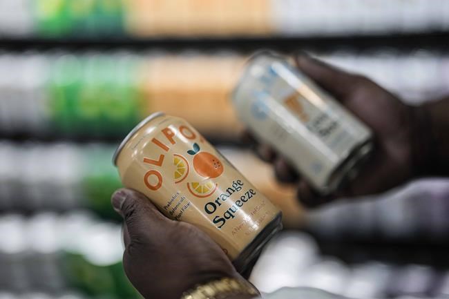 Cans of Olipop, a soda containing botanicals, plant fibers, and prebiotics, are shown at a Kroger supermarket, Friday, April 12, 2024, in Marietta, Ga. U.S. sales of prebiotic and probiotic drinks more than tripled last year. (AP Photo/Mike Stewart)