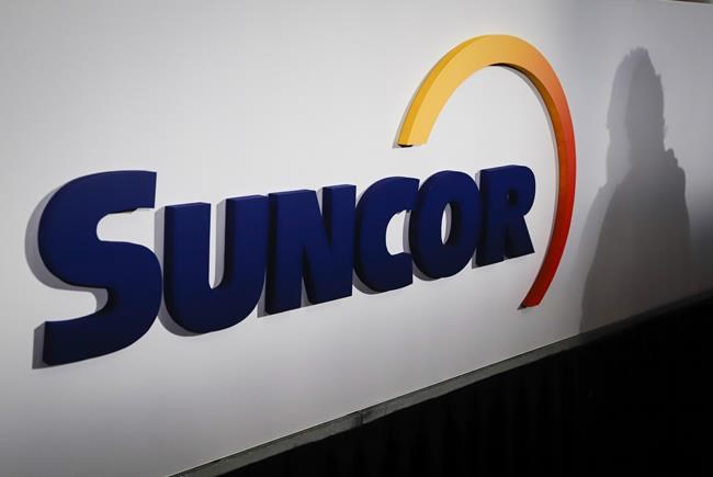 A Suncor logo is shown at the company's annual meeting in Calgary, Thursday, May 2, 2019. THE CANADIAN PRESS/Jeff McIntosh
