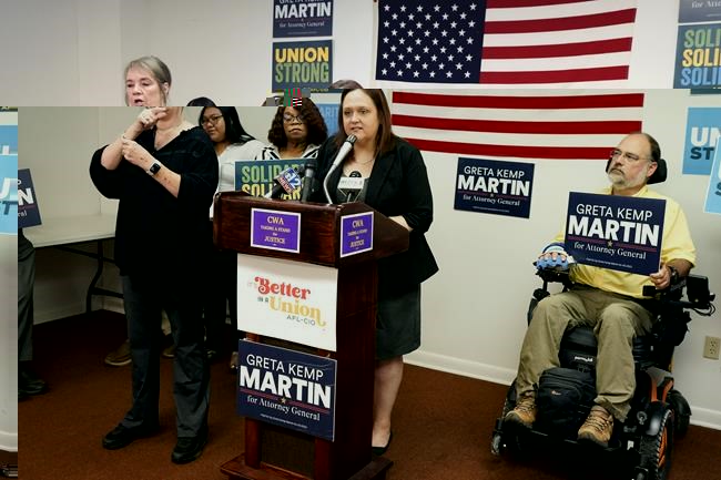 Greta Kemp Martin, the Democratic nominee for Mississippi attorney general, at podium, discusses her proposal to create a fair labor division as part of the attorney general's office during a Thursday, Aug. 31, 2023, news conference in Jackson, Miss. (AP Photo/Rogelio V. Solis)