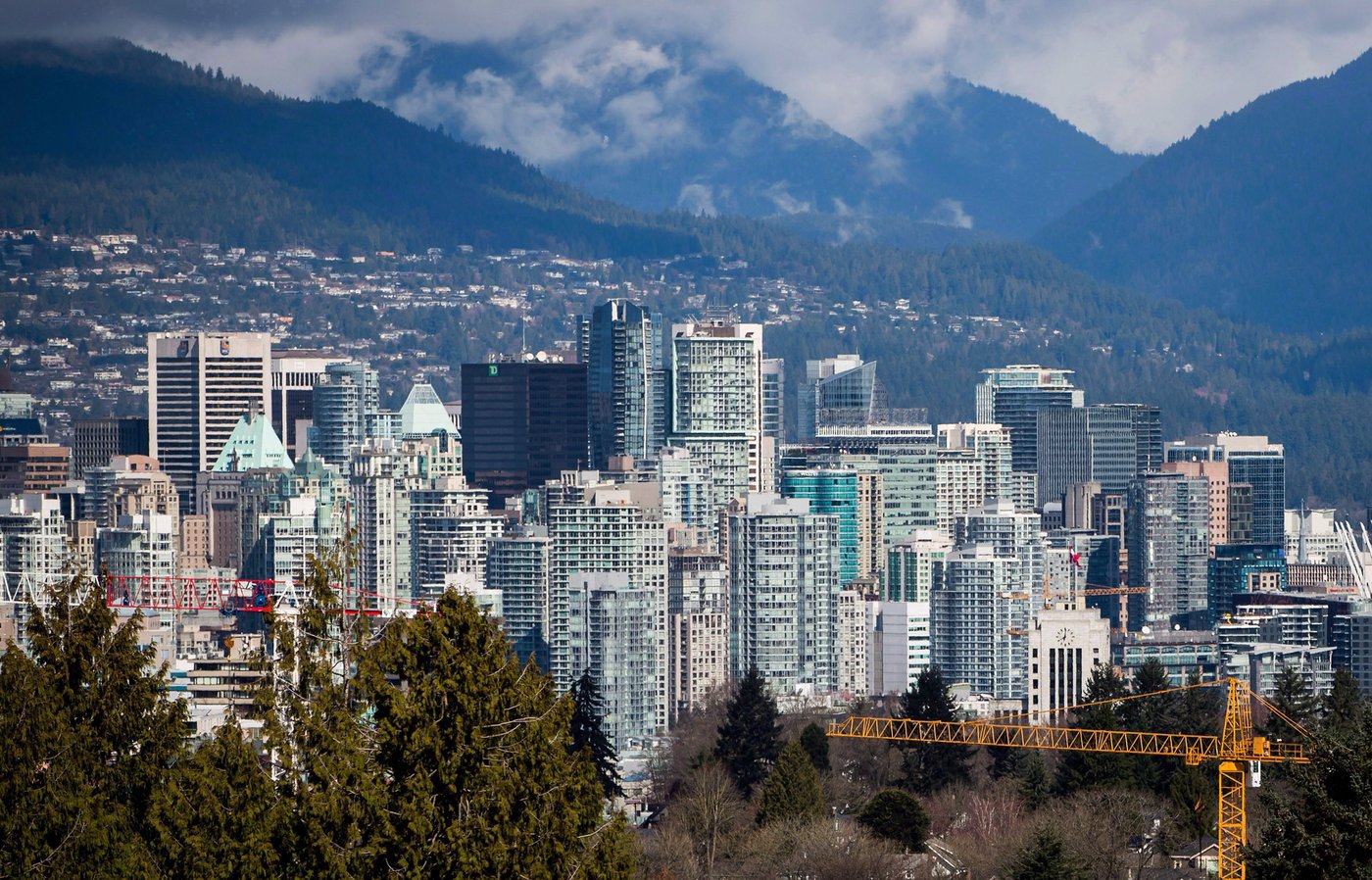 A crane is seen at a condo development under construction as condo and office towers fill the downtown skyline in Vancouver, B.C., on Friday March 30, 2018. THE CANADIAN PRESS/Darryl Dyck