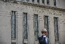 A man walks past a building in Toronto that used to house the Toronto Stock Exchange on Thursday, Aug. 18 2011. THE CANADIAN PRESS/Aaron Vincent Elkaim