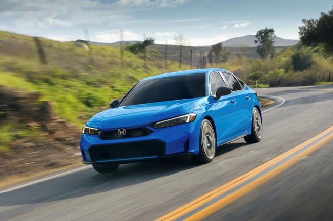 This photo provided by Honda shows the 2025 Civic. A hybrid powertrain is a new option this year and should help the Civic get around 50 mpg. (Courtesy of American Honda Motor Co. via AP)