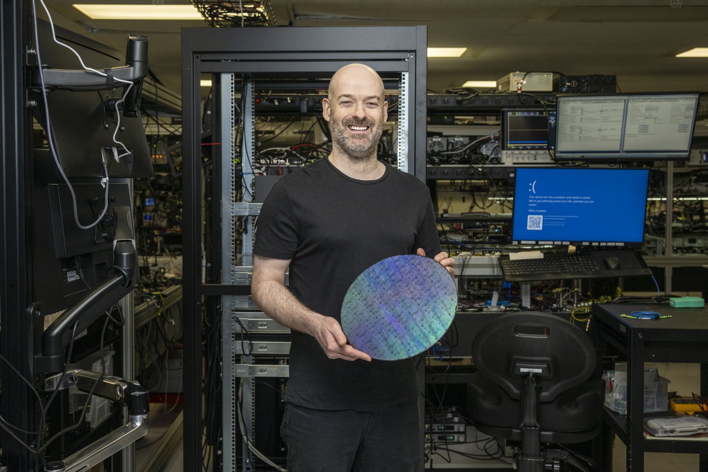 Christian Weedbrook, founder and CEO of Xanadu, holds a wafer designed by the company at its headquarters in Toronto, Wednesday, March 25, 2026. THE CANADIAN PRESS/Eduardo Lima