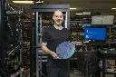 Christian Weedbrook, founder and CEO of Xanadu, holds a wafer designed by the company at its headquarters in Toronto, Wednesday, March 25, 2026. THE CANADIAN PRESS/Eduardo Lima