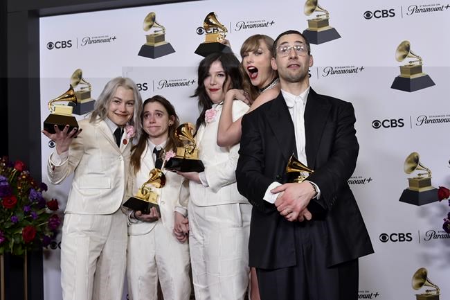 Phoebe Bridgers, from left, Julien Baker, and Lucy Dacus of boygenius pose in the press room with the awards for best rock performance and best rock song for "Not Strong Enough," and best alternative music album for "The Record." Taylor Swift, center right, and Jack Antonoff pose with the award for record of the year for "Midnights" during the 66th annual Grammy Awards on Sunday, Feb. 4, 2024, in Los Angeles. (Photo by Richard Shotwell/Invision/AP)