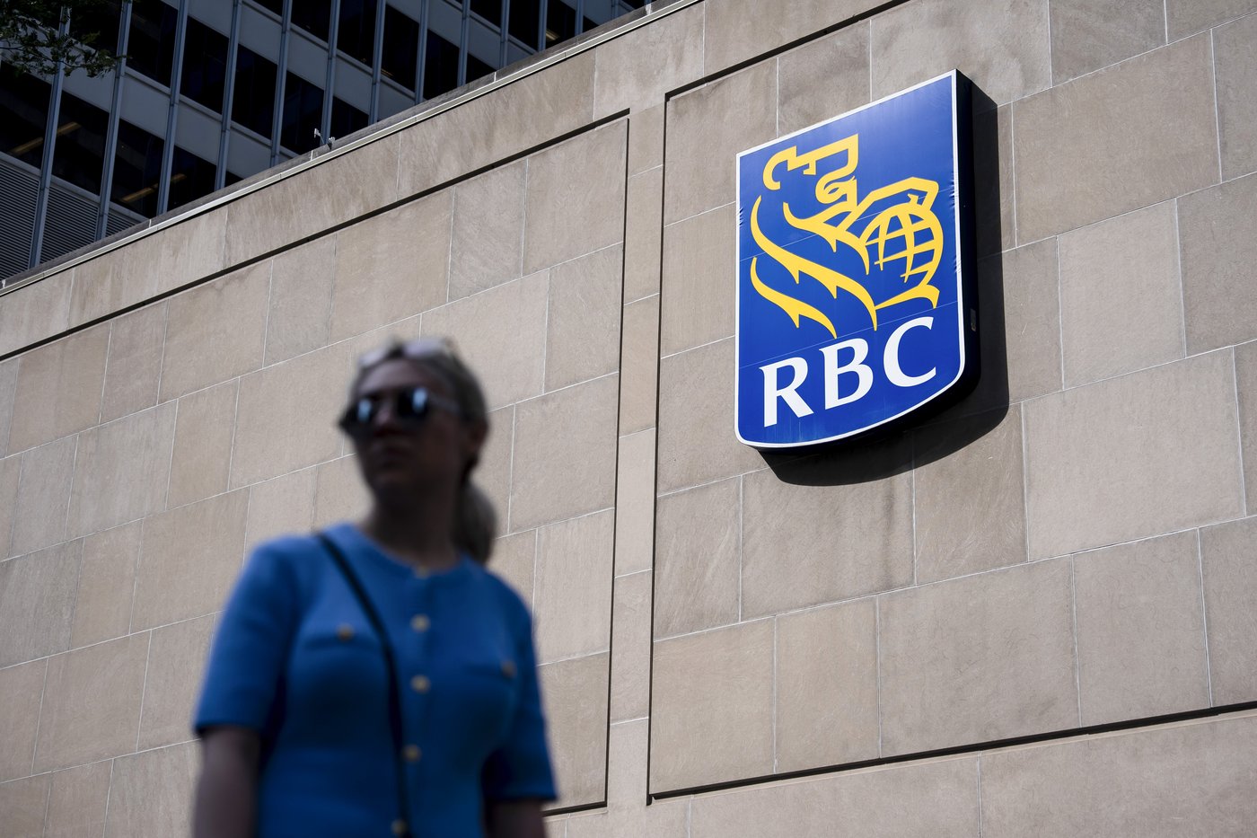 People walk past the Royal Bank Tower in Montreal on Thursday, June 19, 2025. THE CANADIAN PRESS/Christopher Katsarov