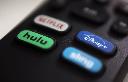 The logos for streaming services Netflix, Hulu, Disney Plus and Sling TV are pictured on a remote control on Aug. 13, 2020. (AP Photo/Jenny Kane, File)