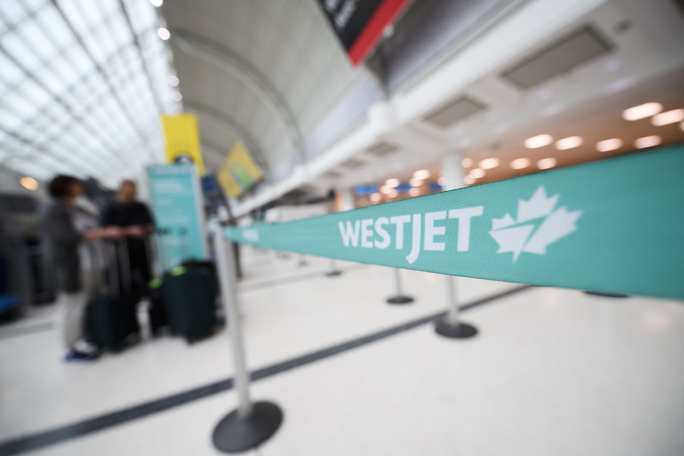 The WestJet check-in area at Pearson International Airport is photographed in Toronto, Saturday, June 29, 2024. THE CANADIAN PRESS/Christopher Katsarov”