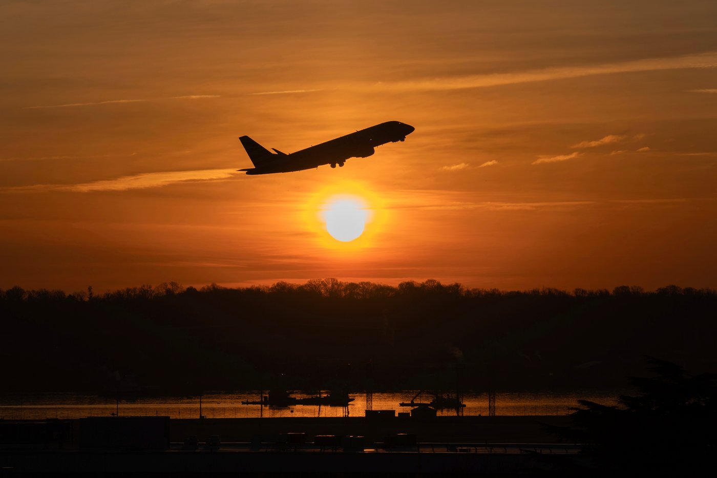 FILE - An airplane lifts off from Ronald Reagan Washington National Airport as the sun rises Feb. 3, 2025, in Arlington, Va. (AP Photo/Jose Luis Magana, File)