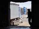 A Canada Border Services officer looks over at a truck as it waits to be inspected at the Highway 55 Port of Entry in Stanstead, Que., Thursday, March 13, 2025. THE CANADIAN PRESS/Christinne Muschi