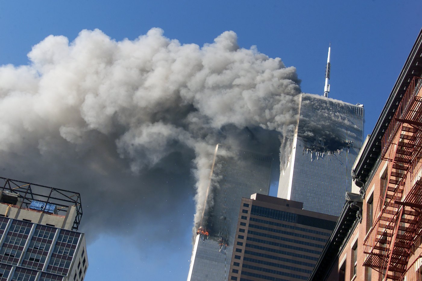 Smoke rises from the burning twin towers of the World Trade Center after hijacked planes crashed into the towers, Sept. 11, 2001, in New York. THE CANADIAN PRESS/AP-Richard Drew
