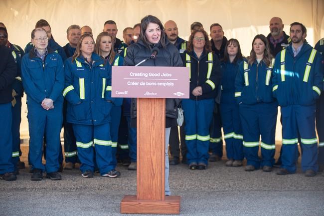 Alberta Premier Danielle Smith speaks at the Dow Chemical announcement, that will finalized plans to construct the world's first net-zero carbon emissions ethylene and derivatives complex, in Fort Saskatchewan Alberta, on Wednesday November 29, 2023. Canadian Utilities Ltd., a subsidiary of Calgary-based holding company ATCO Ltd., says it plans to build a new natural gas pipeline in Alberta to supply a massive net-zero petrochemical project being built northeast of Edmonton. THE CANADIAN PRESS/Jason Franson