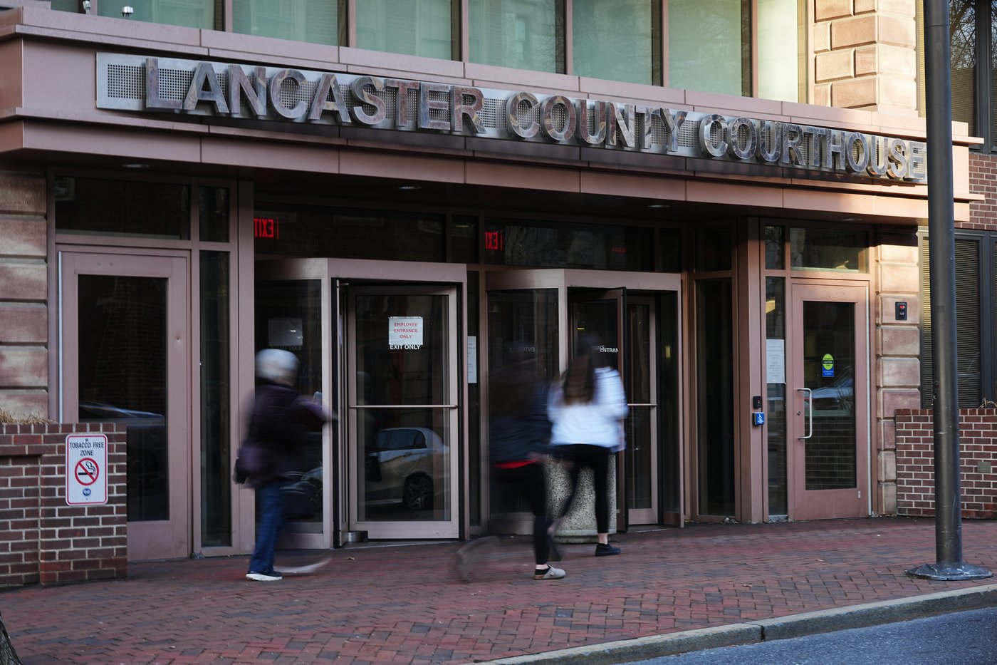People enter the Lancaster County Courthouse in Lancaster, Pa., Wednesday, March 25, 2026. (AP Photo/Matt Rourke)