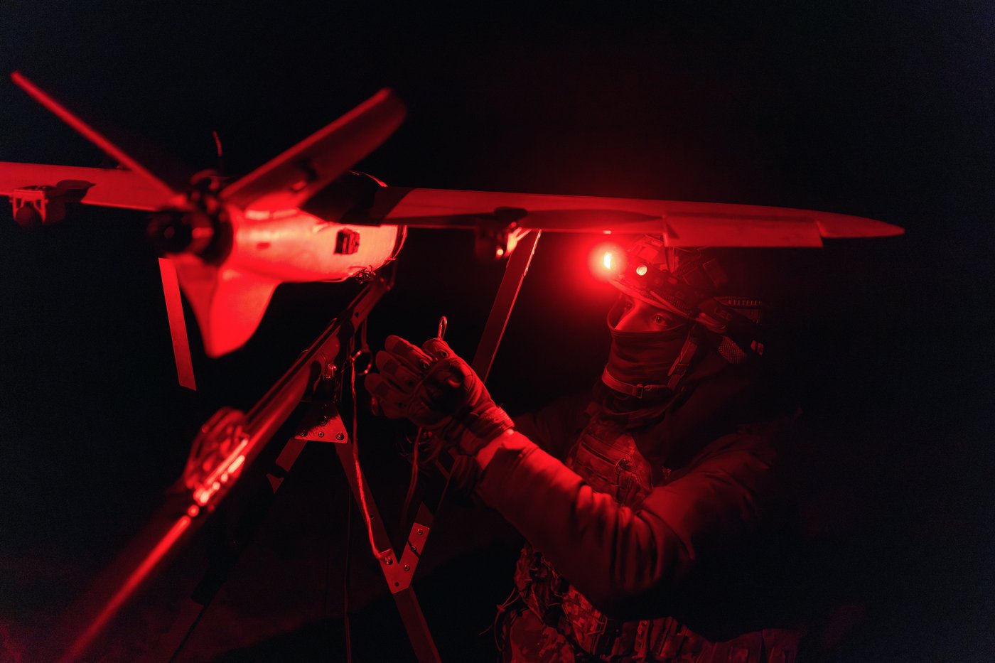 A soldier of the 127th Separate Territorial Brigade launches a drone to search for Russian attack drones at the front line in the Kharkiv region Saturday, March 14, 2026. (AP Photo/Nikoletta Stoyanova)