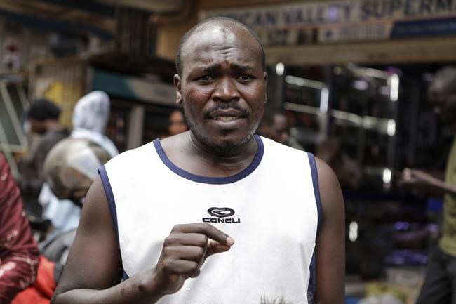 Zubairi Idi Nyakuni, a driver of motorcycle taxi, known locally as boda-boda, speaks during an interview on a street of Kampala, Uganda, on July 18, 2024. (AP Photo/Hajarah Nalwadda )