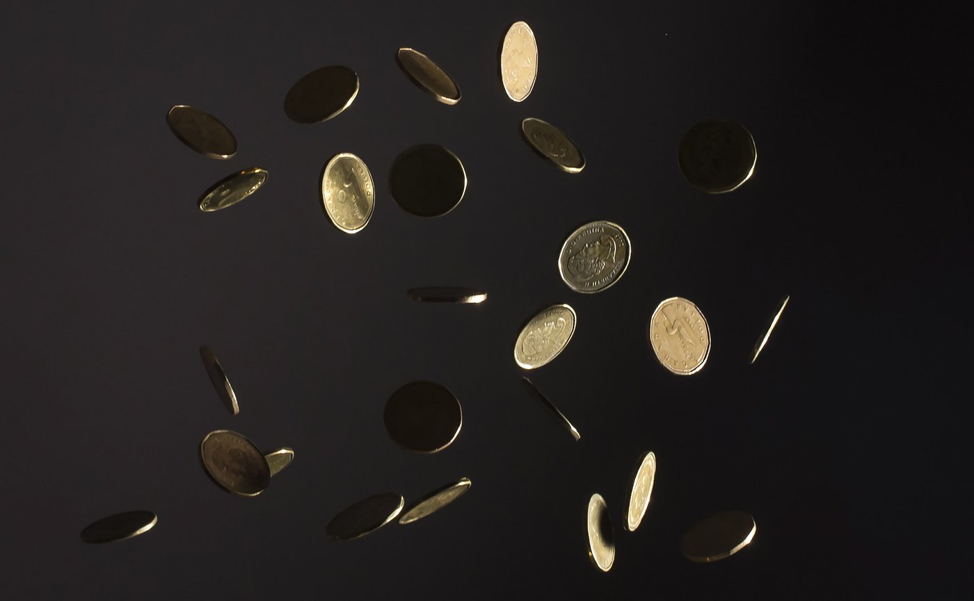 Falling Canadian dollar coins or loonies are pictured in North Vancouver, B.C. Wednesday, May 29, 2019. THE CANADIAN PRESS/Jonathan Hayward