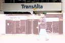 A pedestrian walks past the TransAlta building in downtown Calgary, Monday, Oct. 5, 2009. THE CANADIAN PRESS/Jeff McIntosh