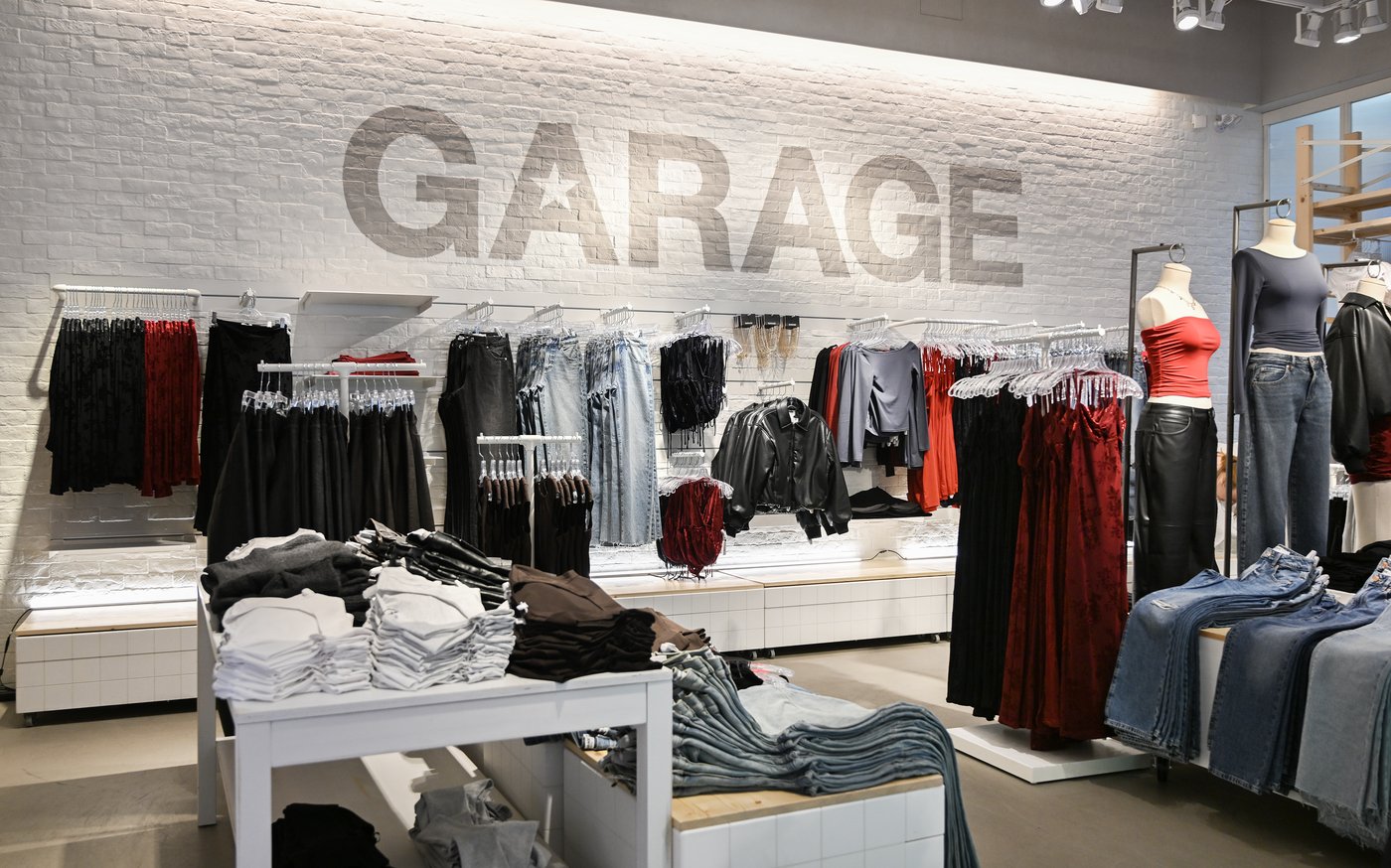 Clothing is on display inside a Garage clothing retail store in Montreal, Friday, Nov. 15, 2024. THE CANADIAN PRESS/Graham Hughes
