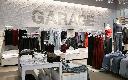 Clothing is on display inside a Garage clothing retail store in Montreal, Friday, Nov. 15, 2024. THE CANADIAN PRESS/Graham Hughes