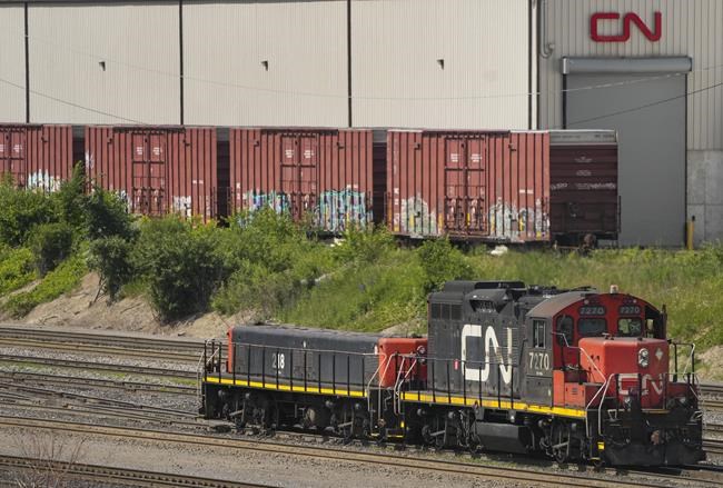 The union representing more than 9,000 workers at Canada's two biggest railways say public safety is at stake as contract negotiations temporarily ground to a halt last week, with a potential strike on the horizon. CN rail trains are shown at a train yard in Vaughan, Ont., on Monday, June 20, 2022. THE CANADIAN PRESS/Nathan Denette