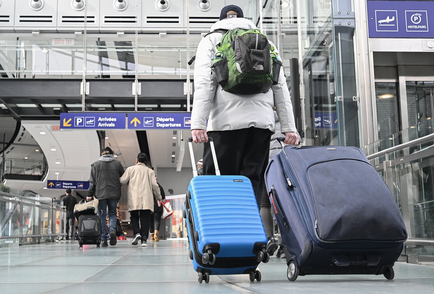 A traveller wheels their baggage through Trudeau airport in Montreal, Friday, January 3, 2025. THE CANADIAN PRESS/Graham Hughes.
