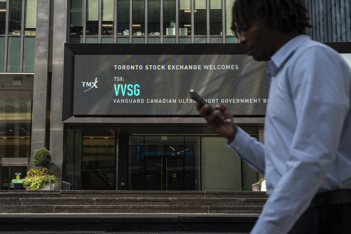 A person walks past the TMX Market Centre in Toronto, Wednesday, Sept. 11, 2024. THE CANADIAN PRESS/Paige Taylor White