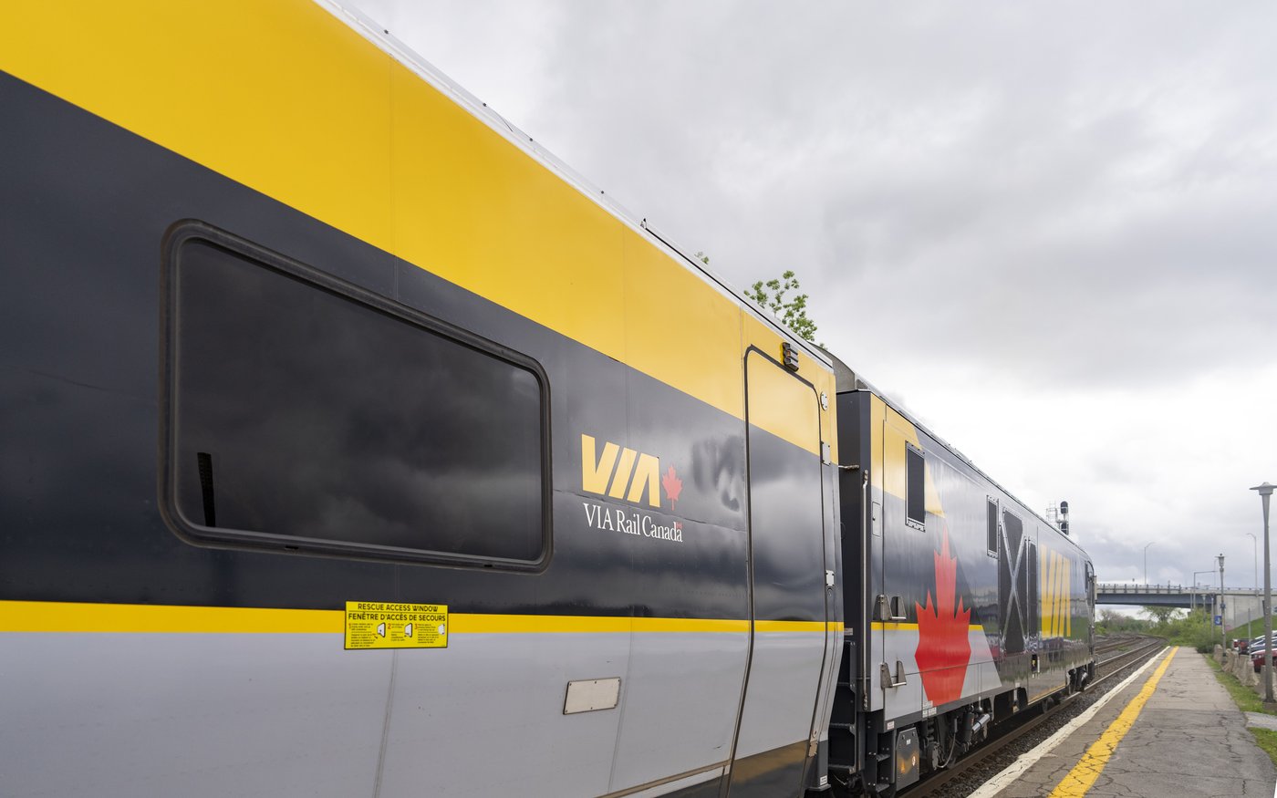 A Via Rail train is seen on tracks in Dorval, Que., as it heads out of Montreal on Friday, May 23, 2025. THE CANADIAN PRESS/Christinne Muschi