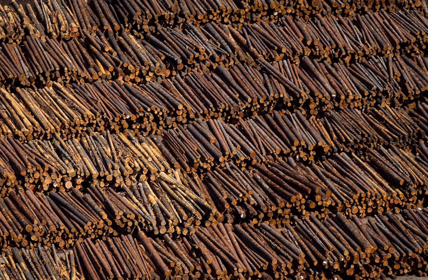 Logs are seen in an aerial view stacked at the Interfor sawmill, in Grand Forks, B.C., Saturday, May 12, 2018. An unexpected rebound in wood product prices this month is boosting profits for Canadian forestry companies but leaving homeowners and buyers with the prospect of higher home and renovation costs in 2021. THE CANADIAN PRESS/Darryl Dyck