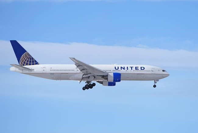 A United Airlines jetliner heads in for a landing at Denver International Airport after a winter storm swept through the region Tuesday, Jan. 16, 2024, in Denver. Forecasters predict that the frigid weather will persist until midweek in the intermountain West. (AP Photo/David Zalubowski)
