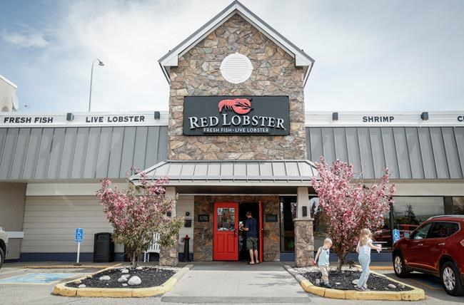 A Canadian court has cleared the reorganization plan of Red Lobster that will see the seafood chain exit bankruptcy. A family leaves a Red Lobster location in Calgary, Alta., Tuesday, May 28, 2024. THE CANADIAN PRESS/Jeff McIntosh