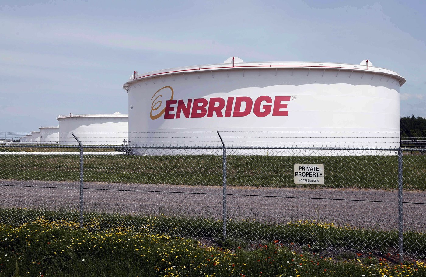 This June 29, 2018 photo shows tanks at the Enbridge Energy terminal in Superior, Wis. For the second time in a year, the federal government is invoking a little-known 1977 energy treaty between Canada and the United States to defend the Line 5 pipeline. This time, it’s in Wisconsin, where Line 5 skirts the southwestern shores of Lake Superior before crossing into Michigan. THE CANADIAN PRESS/AP-Jim Mone