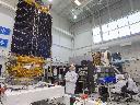 Jean-Michel Leclerc, centre, lead engineer of the Radarsat Constellation Mission is seen with two of the three satellites at the MDA facility Thursday, June 21, 2018 in Montreal. THE CANADIAN PRESS/Ryan Remiorz