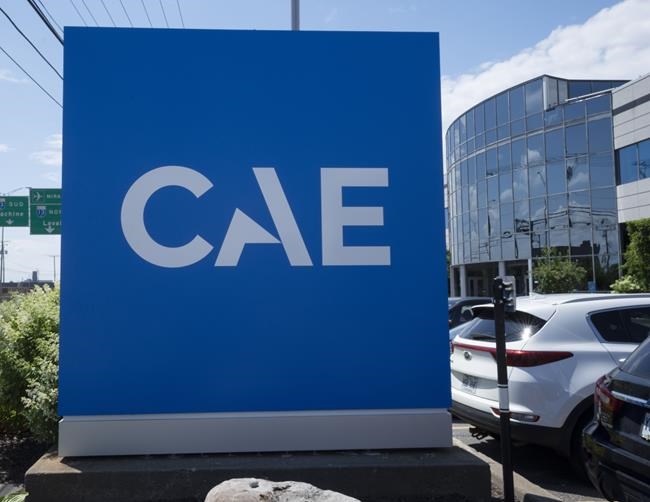 The CAE logo is seen in front of the aerospace company’s plant, Thursday, July 21, 2022 in Montreal. THE CANADIAN PRESS/Ryan Remiorz
