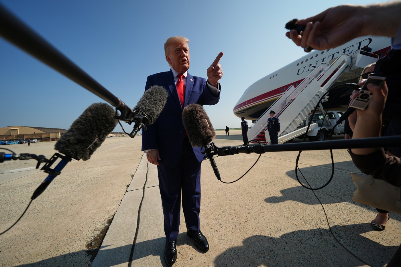 President Donald Trump speaks to reporters before boarding Air Force One, Wednesday, July 22, 2026, at Joint Base Andrews, Md. (AP Photo/Julia Demaree Nikhinson)