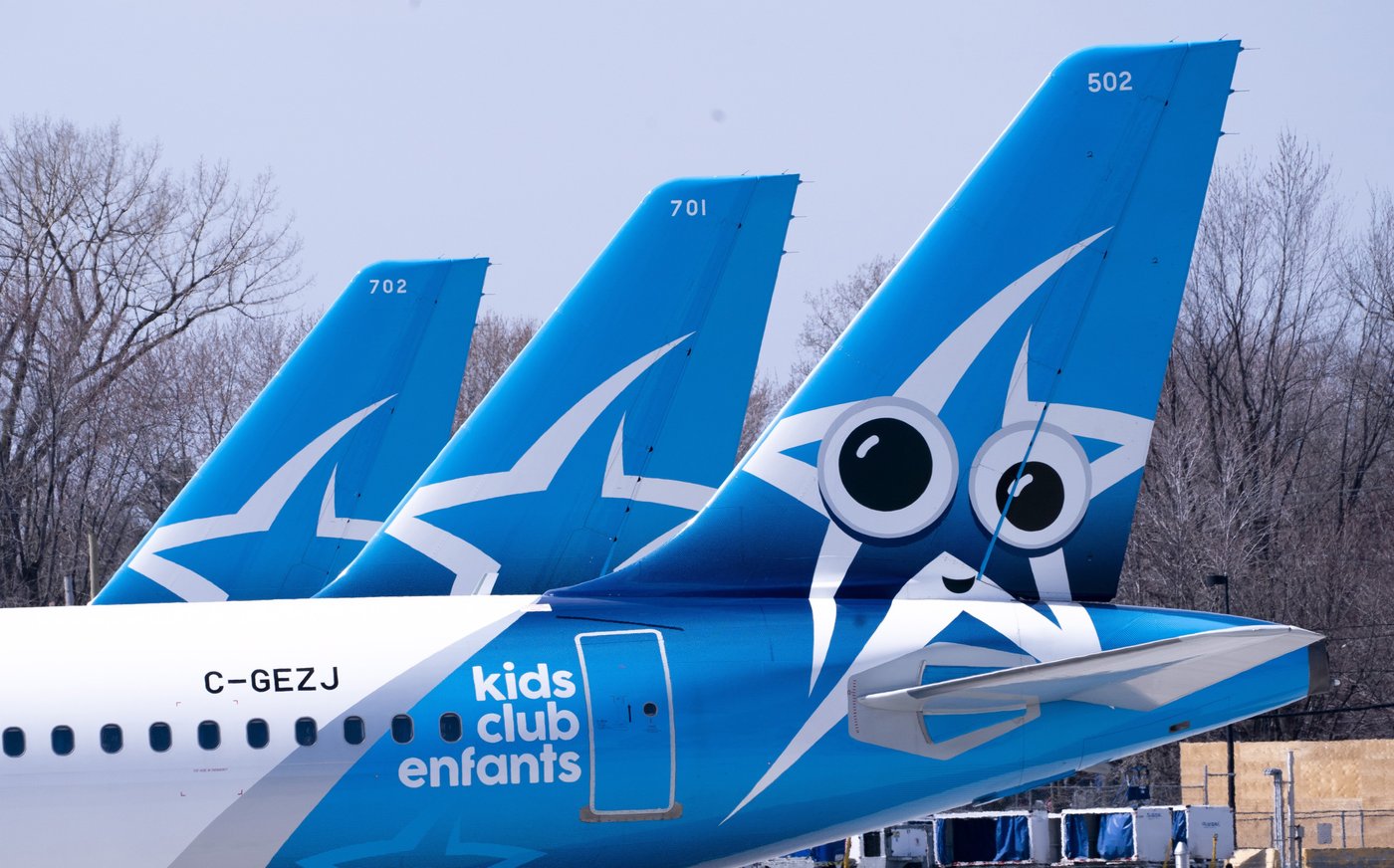 Air Transat aircraft are seen on the tarmac at Montreal-Trudeau International Airport in Montreal, on Wednesday, April 8, 2020. THE CANADIAN PRESS/Paul Chiasson