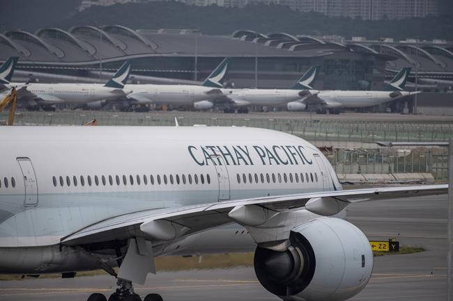 FILE - A Cathay Pacific airplane taxis at Hong Kong International Airport in Hong Kong on Nov. 25, 2022. (AP Photo/Vernon Yuen, File)