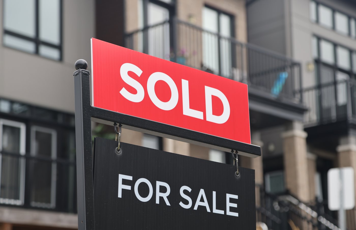 A for sale/sold sign stands in front of residential homes in the Riverside South neighbourhood of Ottawa on Friday, Aug. 30, 2024. THE CANADIAN PRESS/ Patrick Doyle