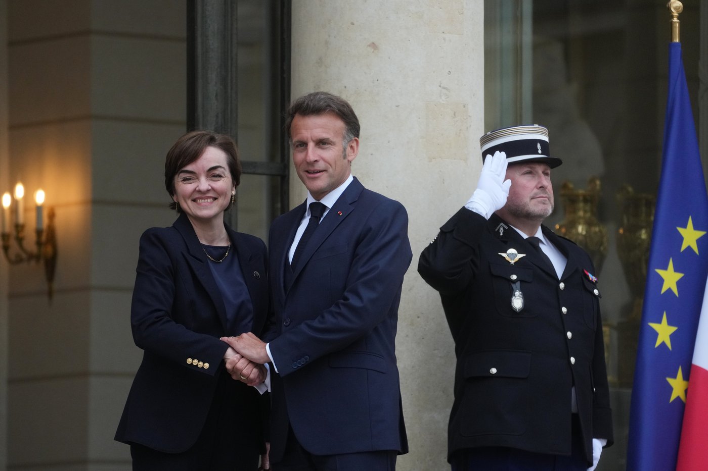 Quebec Premier Christine Frechette is greeted by French President Emmanuel Macron before a meeting at the Elysée Palace in Paris, Monday, May 18, 2026. (AP Photo/Thibault Camus)