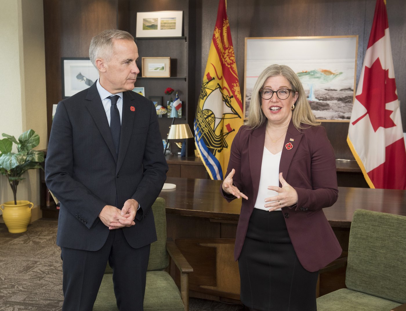 Prime Minister Mark Carney left, meets with New Brunswick Premier Susan Holt in her office in Fredericton, N.B., on Monday, Nov. 10, 2025. THE CANADIAN PRESS/Stephen MacGillivray