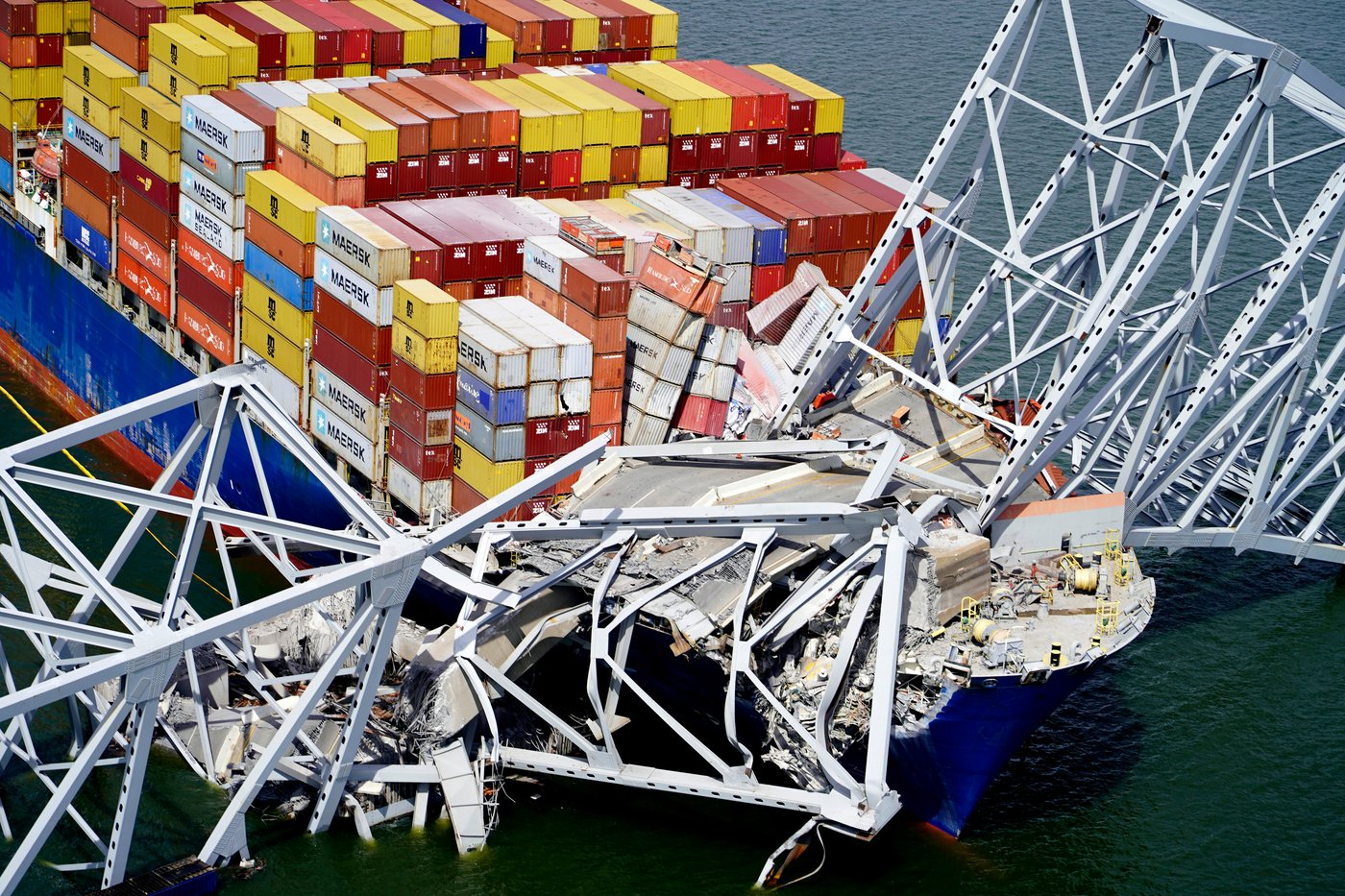 FILE - In this aerial image released by the Maryland National Guard the cargo ship Dali is stuck under part of the structure of the Francis Scott Key Bridge after the ship hit the bridge, March 26, 2024, in Baltimore. (Maryland National Guard via AP, File)